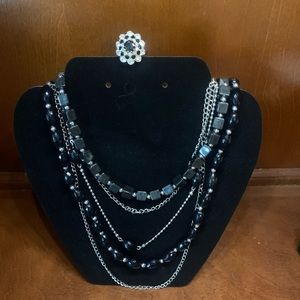Black bead and silver tone necklace with ring